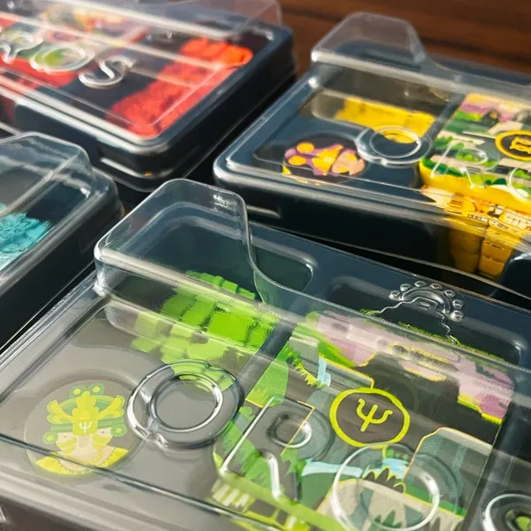 Blackform thermoformed tray for Oros with lidded compartments holding cards and tokens